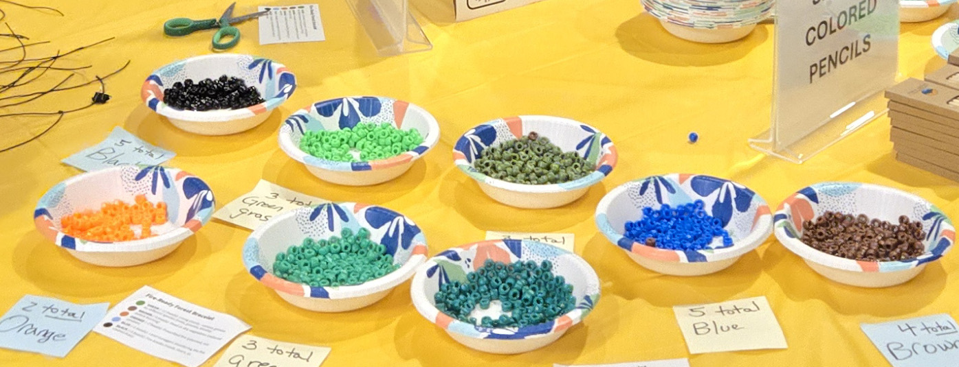 Bowls filled with colored beads on a table